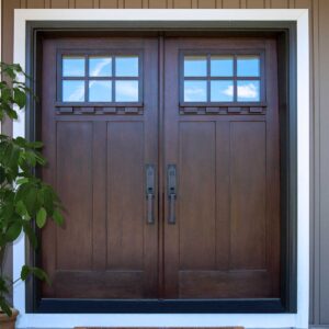 a set of front door with a rich wood appearance