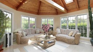 a large sunroom with windows and patio doors